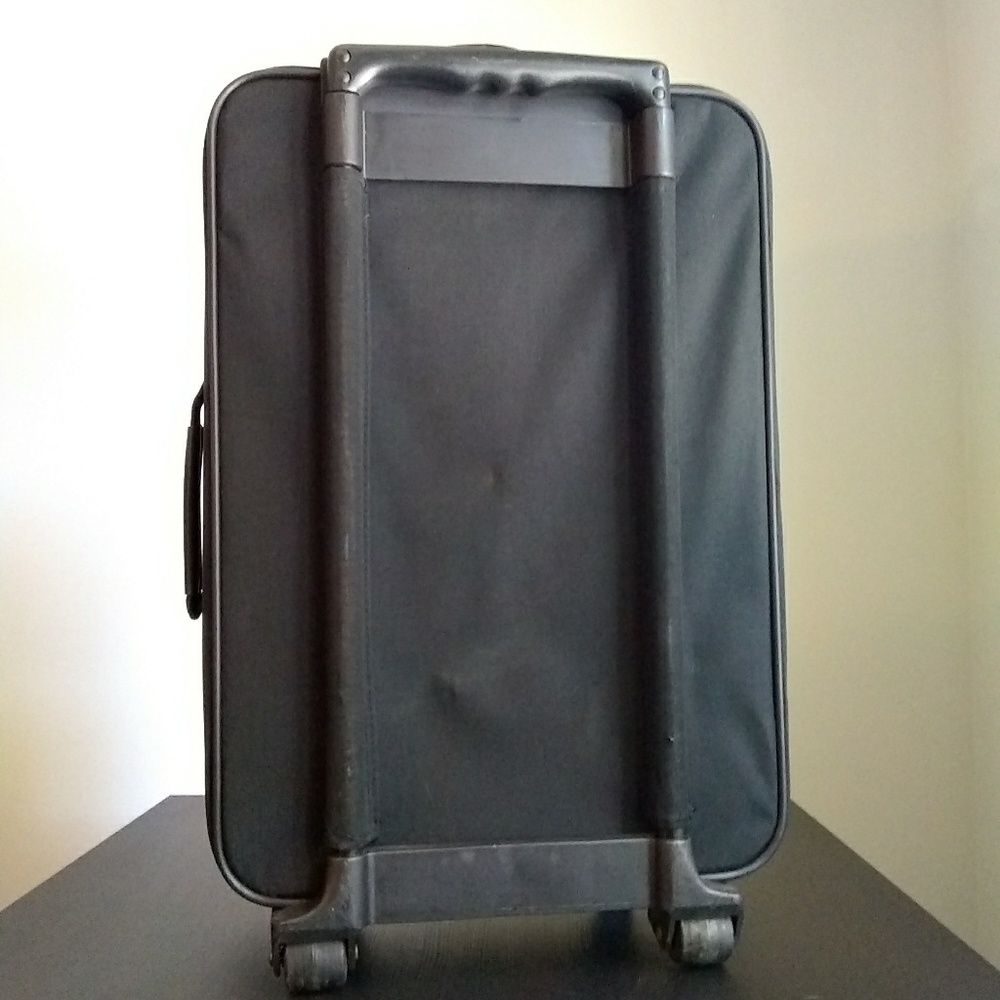 Vintage Lucas rolling suitcase